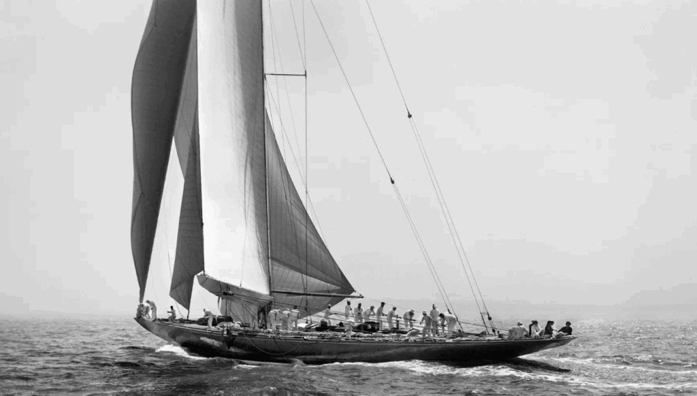 A black and white photo of a sailing boat from The East End Seaport Museum and Marine Foundation.